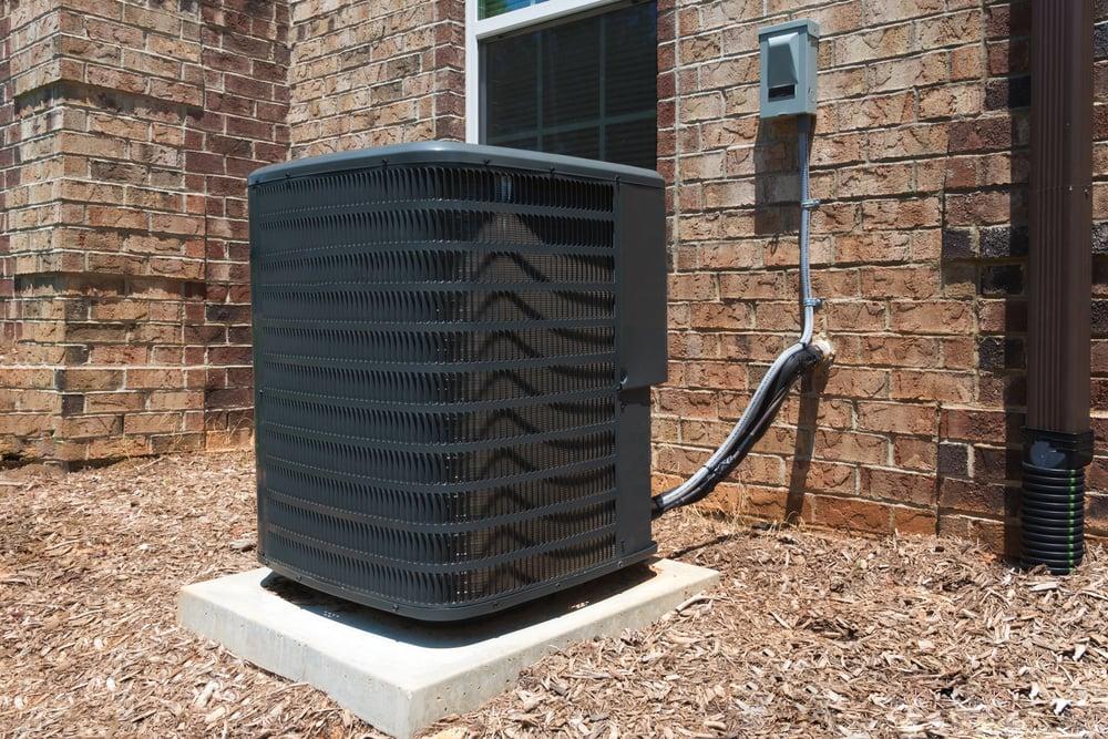 Outdoor HVAC equipment setup at a residential property in the Texas Hill Country